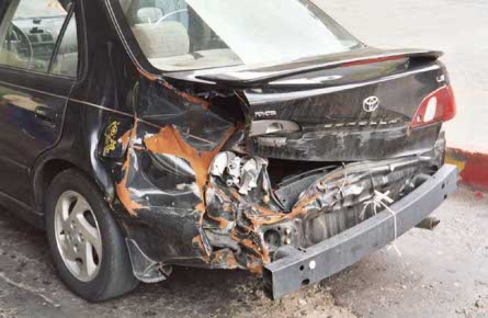 wrecked Toyota Corolla